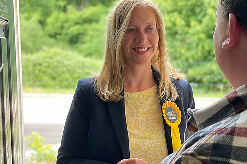 Liz Jarvis knocking on resident's doors